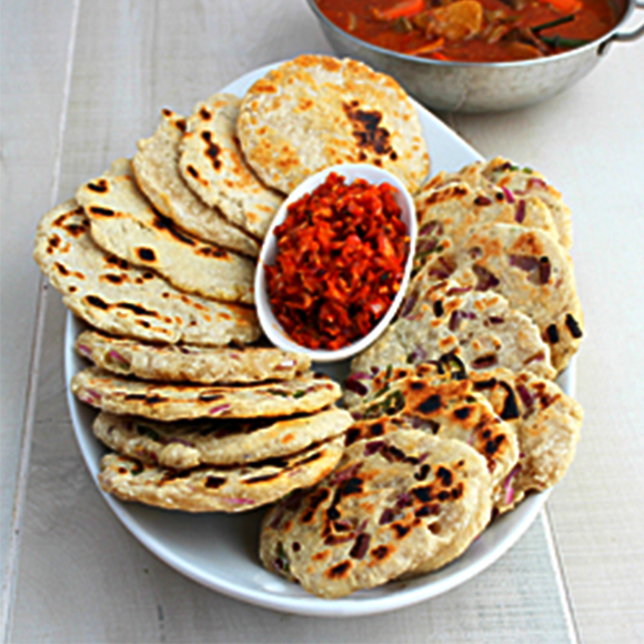 Coconut roti served on board